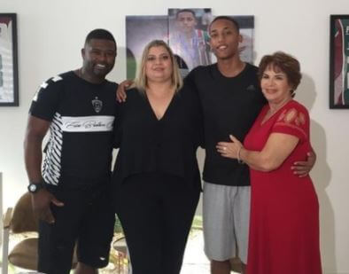 Joao Pedro with his mom, stepdad Carlos and grandmom.